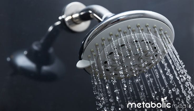Cold shower pouring from shower head