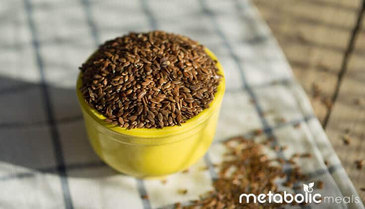 Bowl of flaxseeds on table.