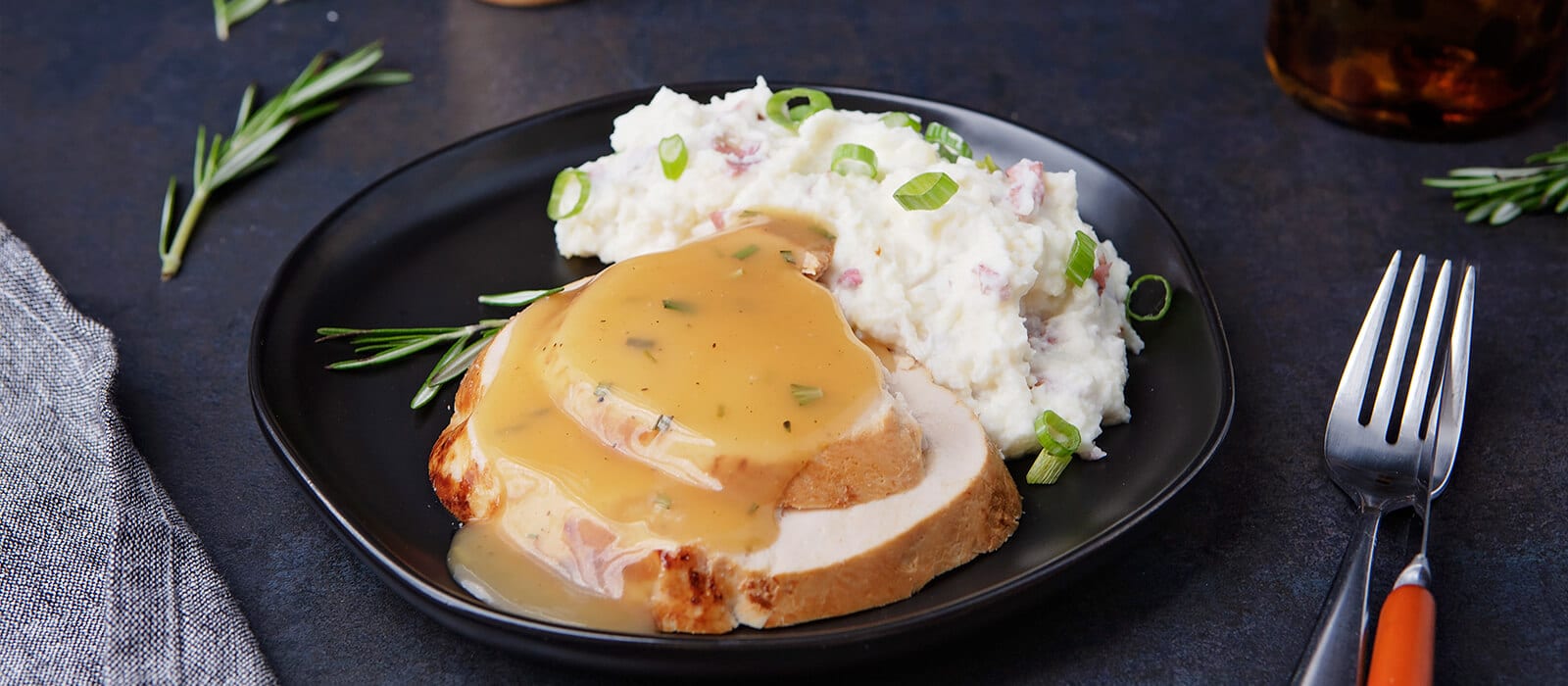 Oven Roasted Turkey Breast with Lemon-Rosemary Sauce and Loaded Garlic Mashed Potatoes